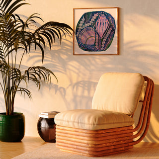 Print of an original painting by Lee Foster-Wilson of shells and seaweed displayed in a sunlit retro living room