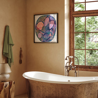 Print of an original painting by Lee Foster-Wilson of fish and shells displayed in a neutral bathroom 