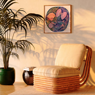 Print of an original painting by Lee Foster-Wilson of fish and shells displayed in a sunlit retro living room