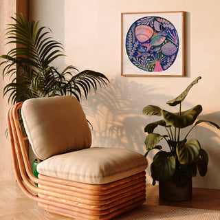 art print of colourful fish, shells and sea anemone by Lee Foster-Wilson displayed in a sunlit retro living room