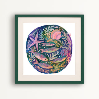 Art print of an original painting of fish, shells and starfish by Lee Foster-Wilson displayed in a dark green frame