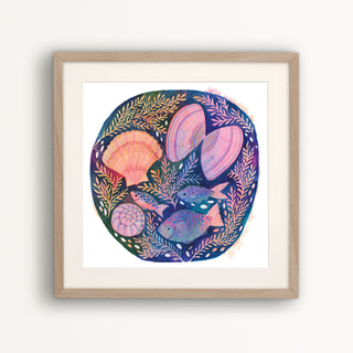 Print of an original painting by Lee Foster-Wilson of fish and shells displayed in a wooden frame